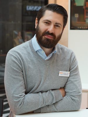 a man with a beard and a name tag